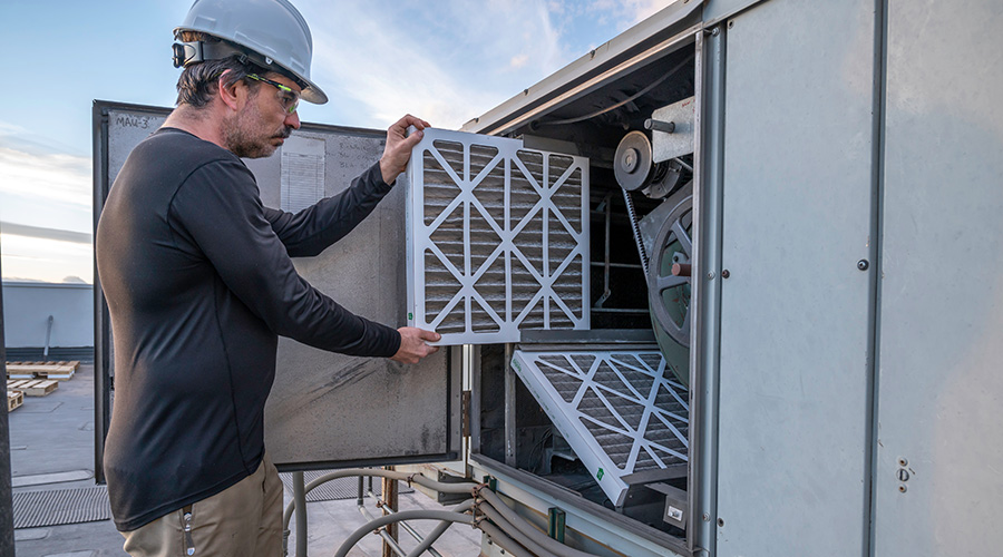 man checking air conditioner 