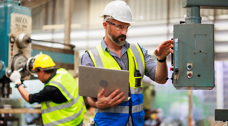 facility manager checking a fuse box 